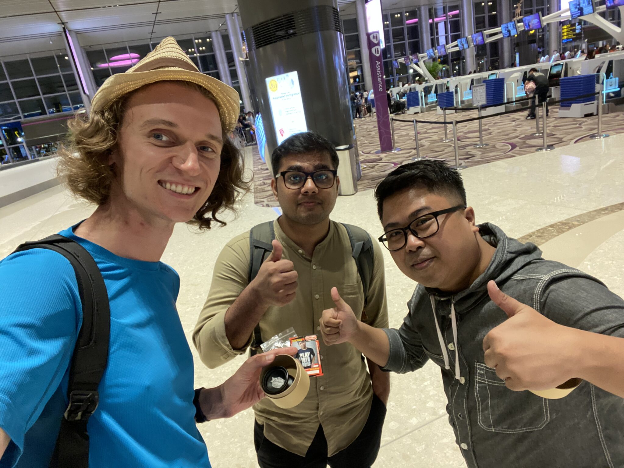 Piotrek, Danish and Fajar at Singapore Airport